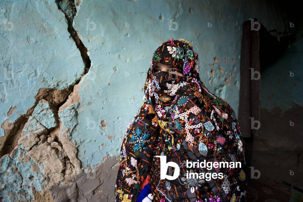 Woman Standing in Siwan House (photo)