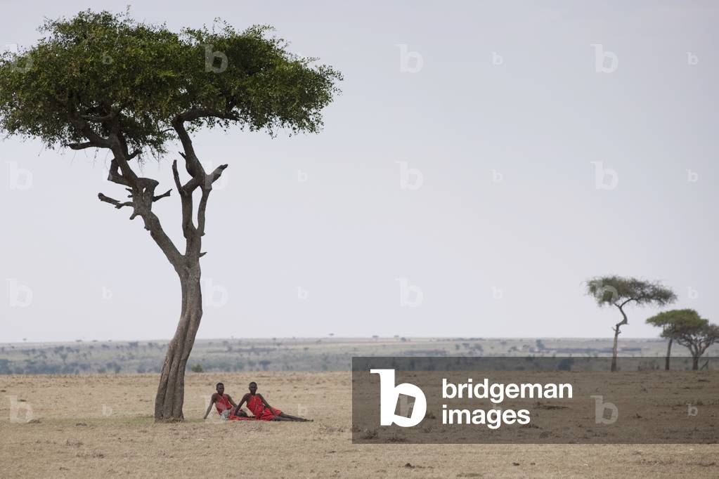 Two Men sitting on the Plain, Kenya, Africa (photo)