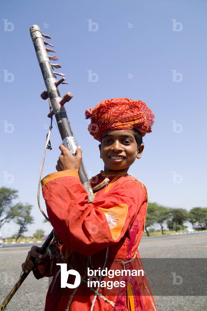 Young Boy with Musical Instrument Called Sarangi, Road to Jodhpur, Rajasthan, India (photo)