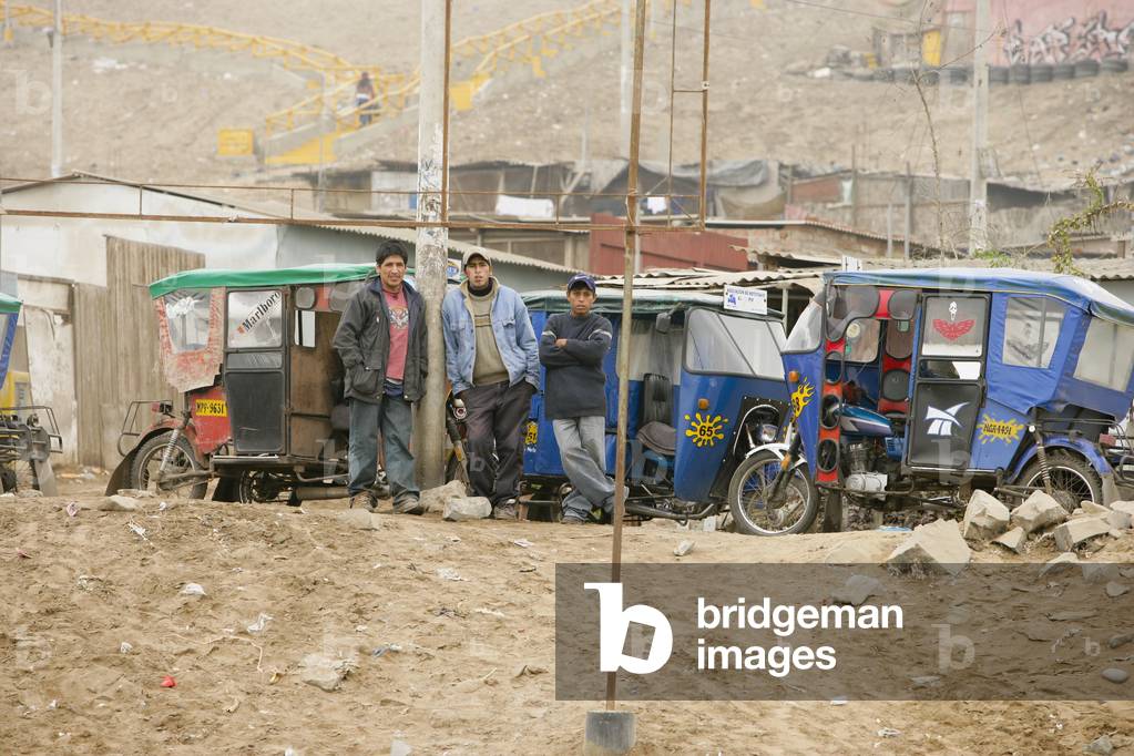 Men Standing by Vehicles, Lima, Peru (photo)
