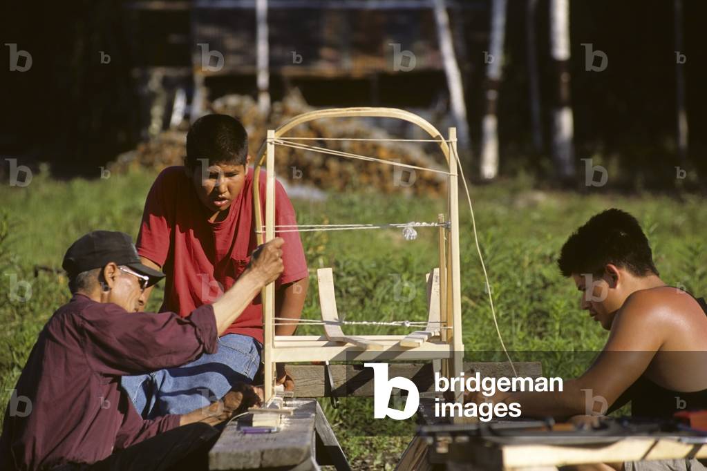 Alaskan Native Man Teaches Sled Building At The Cultural Heritage And Education Institute At Old Minto In Interior Alaska During Summer (photo)