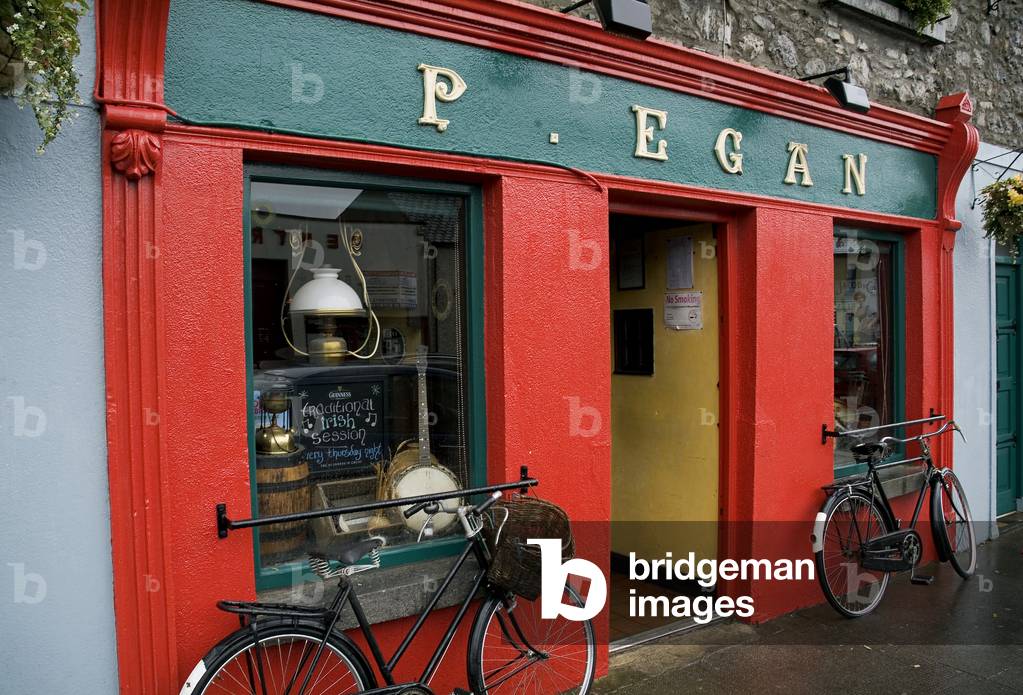 Moate, County Westmeath, Republic Of Ireland; Two Bicycles Parked In Front Of A Store (photo)