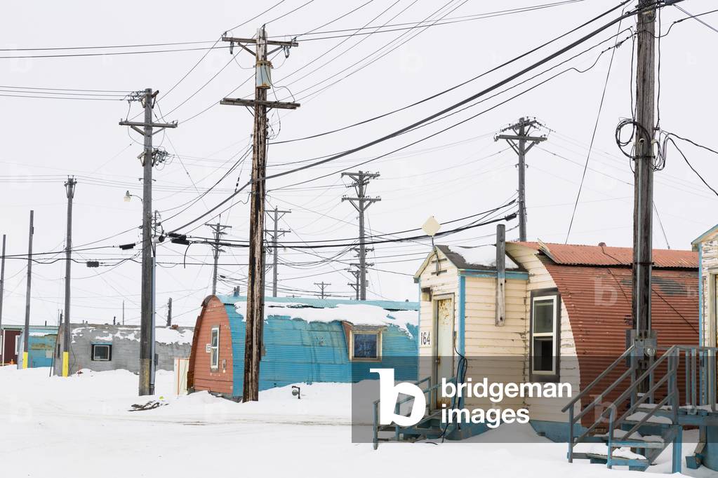 Old Quonset huts with weathered paint chipping off the walls, Barrow Navy base, Pt, Barrow, Barrow, North Slope, Arctic Alaska, USA, Winter (photo)