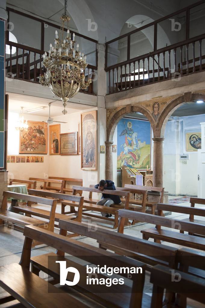 A man prays inside the Greek Orthodox Church of St. George, Madaba, Jordan (photo)