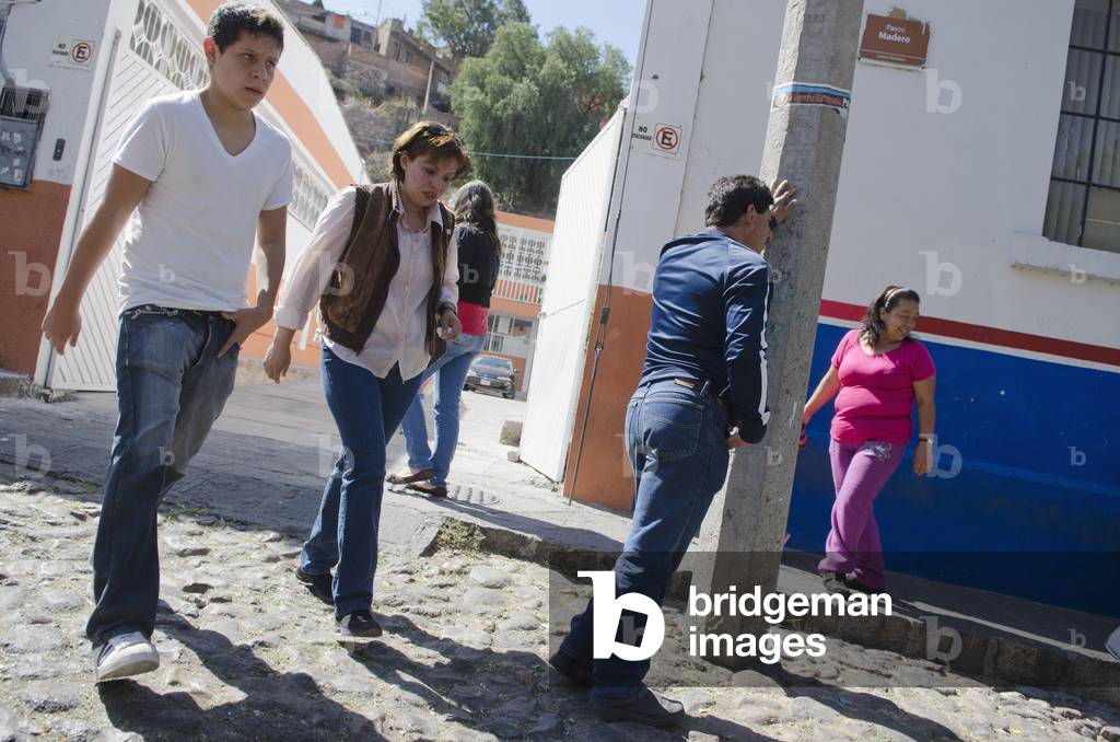 Group of people walking on city side street, Guanajuato, Guanajuato State, Mexico (photo)
