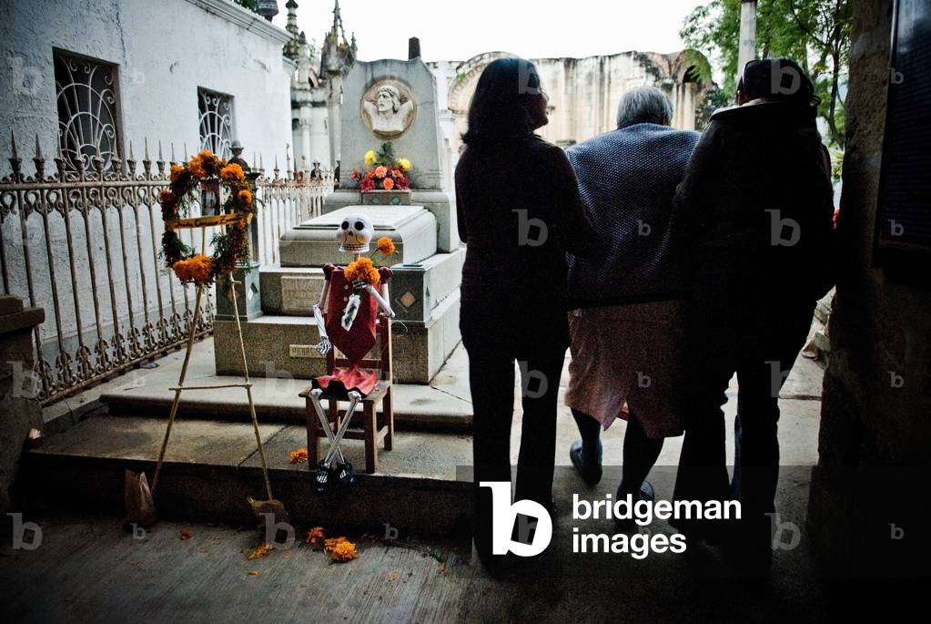 Two Women Assisting an Elderly Relative, Visiting a Cemetery For the Mexican Day of the Dead, Mexico (photo)
