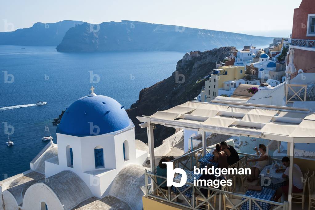 View of the Aegean sea and buildings on the hillside above, Oia, Santorini, Greece (photo)