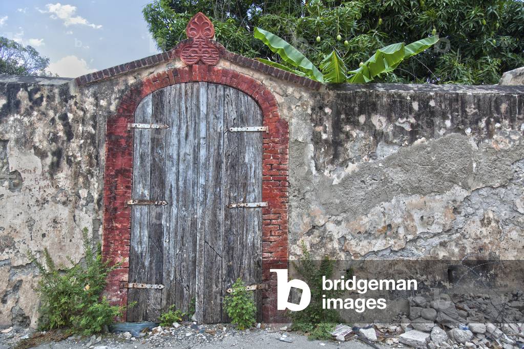 An Old Wooden Gate in a Stone Wall, Jacmel, Haiti (photo)