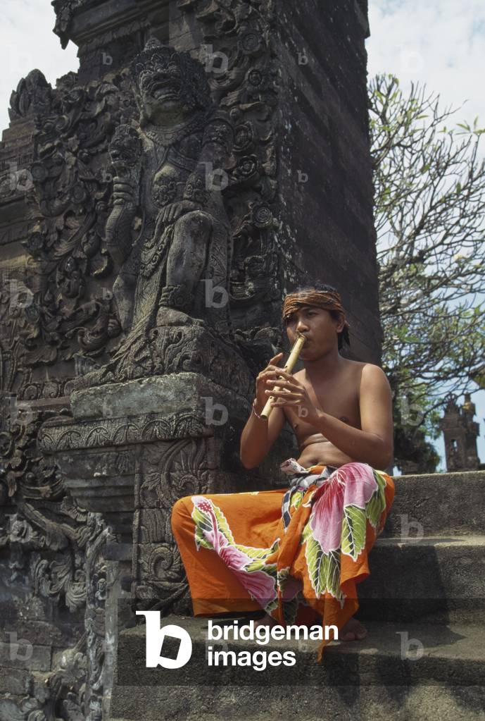 Flute Player at Temple (photo)