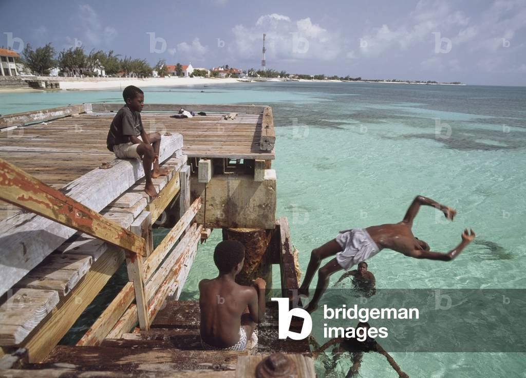 Kids Jumping Off The End of A Pier (photo)