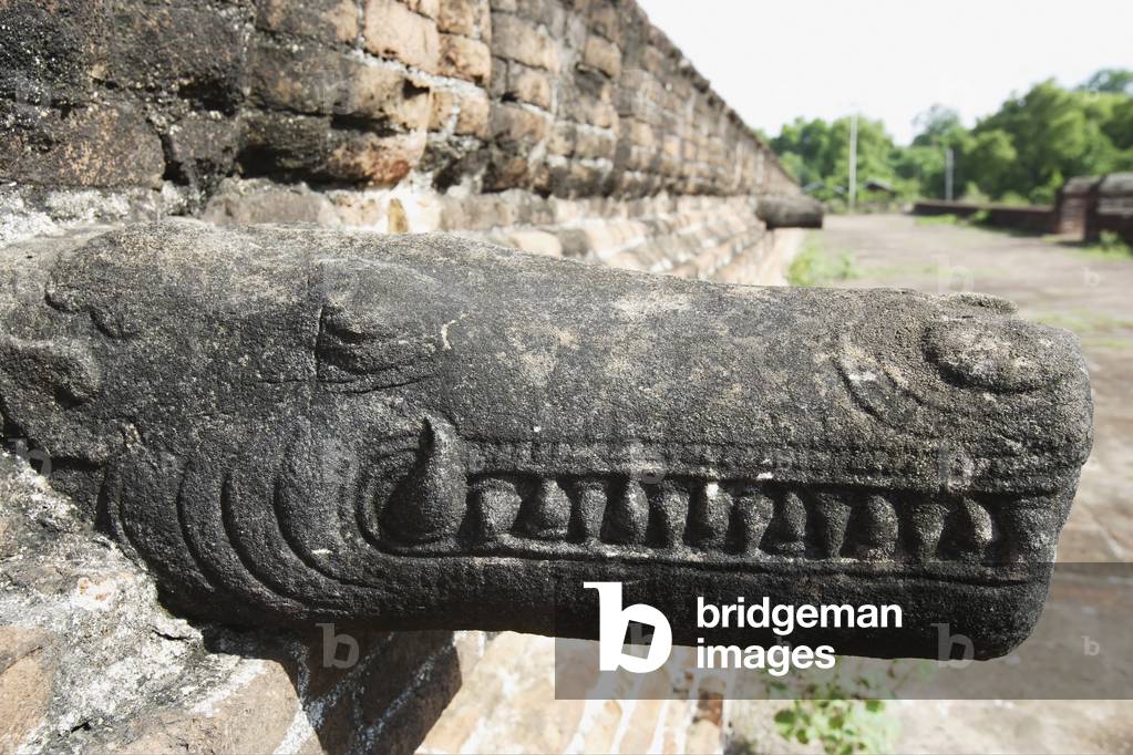 Crocodile-like mythical creature carving at the unfinished Mingun Pagoda that was destroyed by an earthquake, Mandalay, Burma (photo)