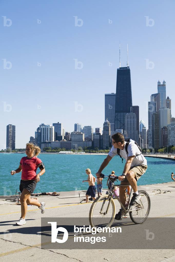 Jogger  and Cyclist on Lakefront Path along Oak Street Beach, Chicago, Illinois, USA (photo)