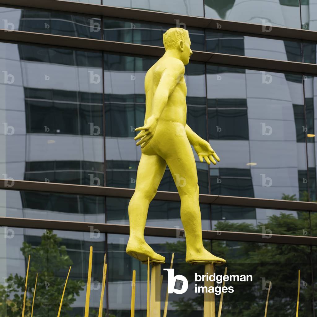 Sculpture of yellow man walking on posts, Santiago, Santiago Metropolitan Region, Chile (photo)