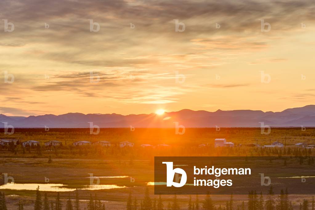 Scenic view of the village of Noatak with the Baird Mountains in the distance at sunrise, Arctic Alaska, USA, Autumn (photo)