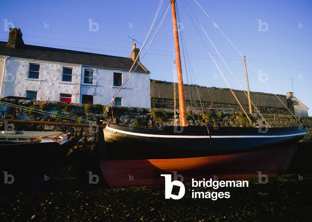 Galway, Co Galway, Ireland; Boat With House In The Background (photo)
