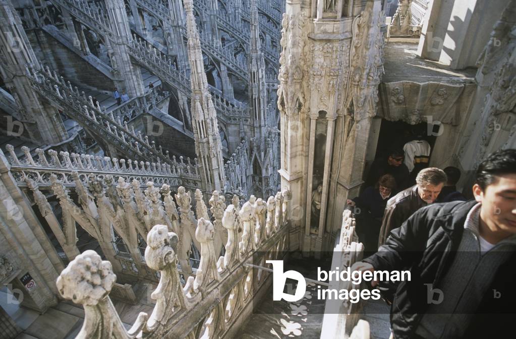 Young Men Walking Ontop of The Roof of Milan Cathedral (photo)