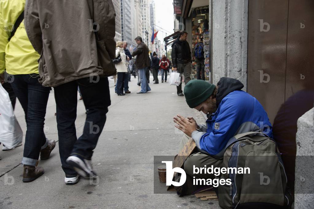 Homeless Man Prays for Help, Manhattan, New York, USA (photo)