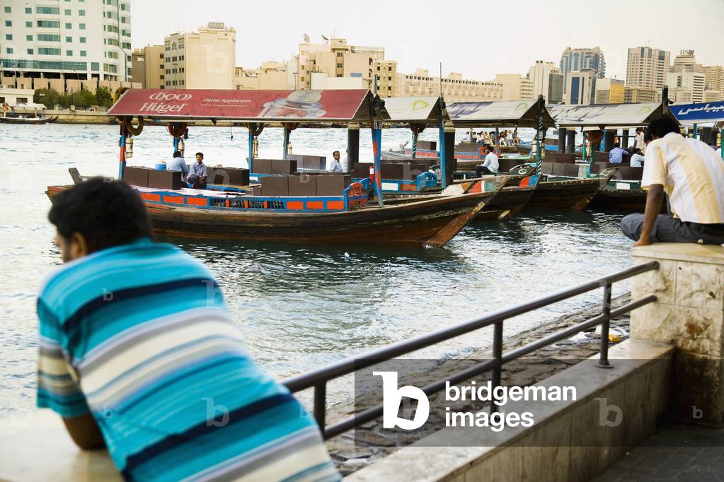 UAE, Man looking at traffic of Dubai Creek, Dubai (photo)