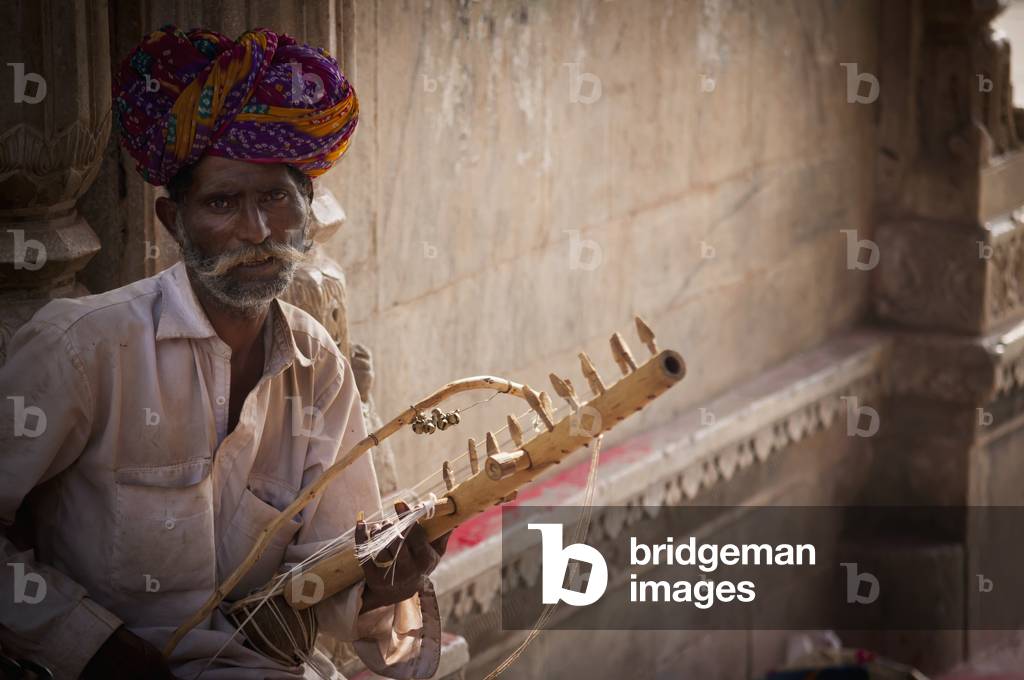 Portrait of Man with Musical Instrument, India (photo)