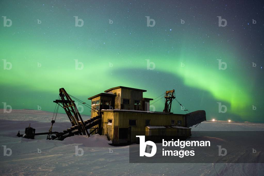 Green Northern Lights Dance Over A Historical Gold Dredge Near Nome, Alaska (photo)