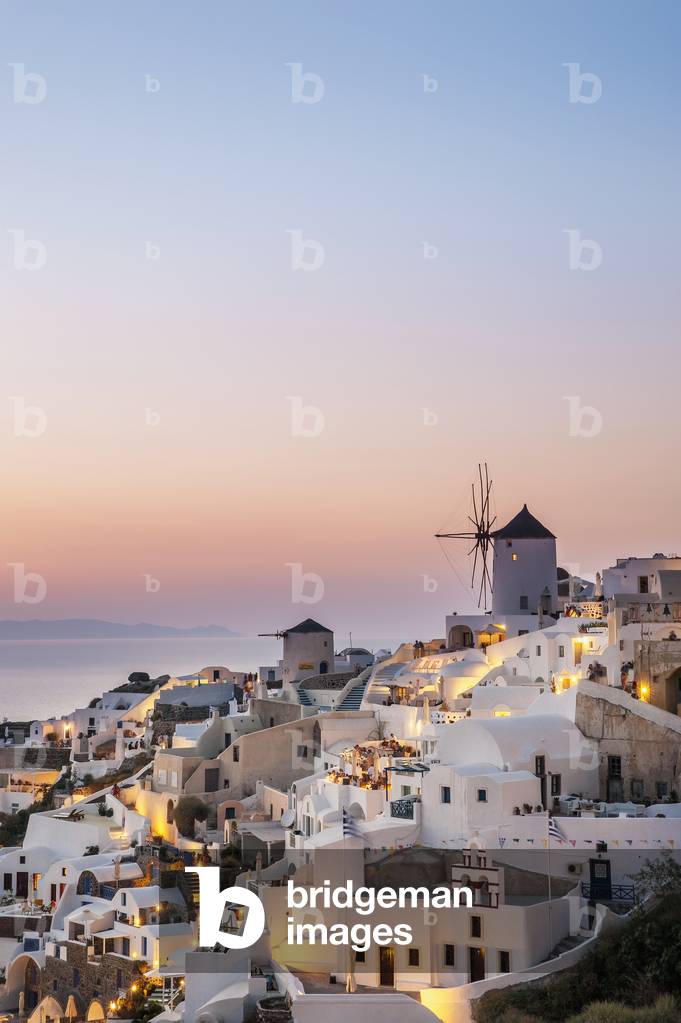 Whitewash buildings and windmill at dusk, Oia, Santorini, Greece (photo)