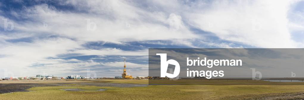 Oil and gas drill rig with surrounding infrastructure, Prudhoe Bay, Arctic Alaska, USA, Summer (photo)
