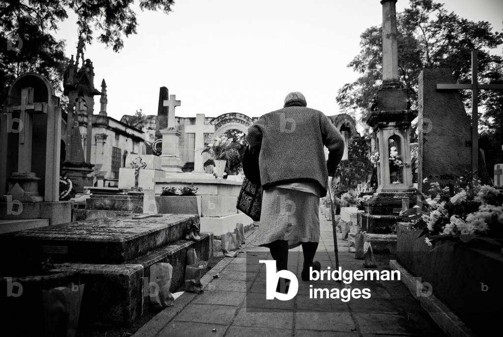 Elderly Woman Visiting a Cemetery For the Mexican Day of the Dead, Mexico (photo)