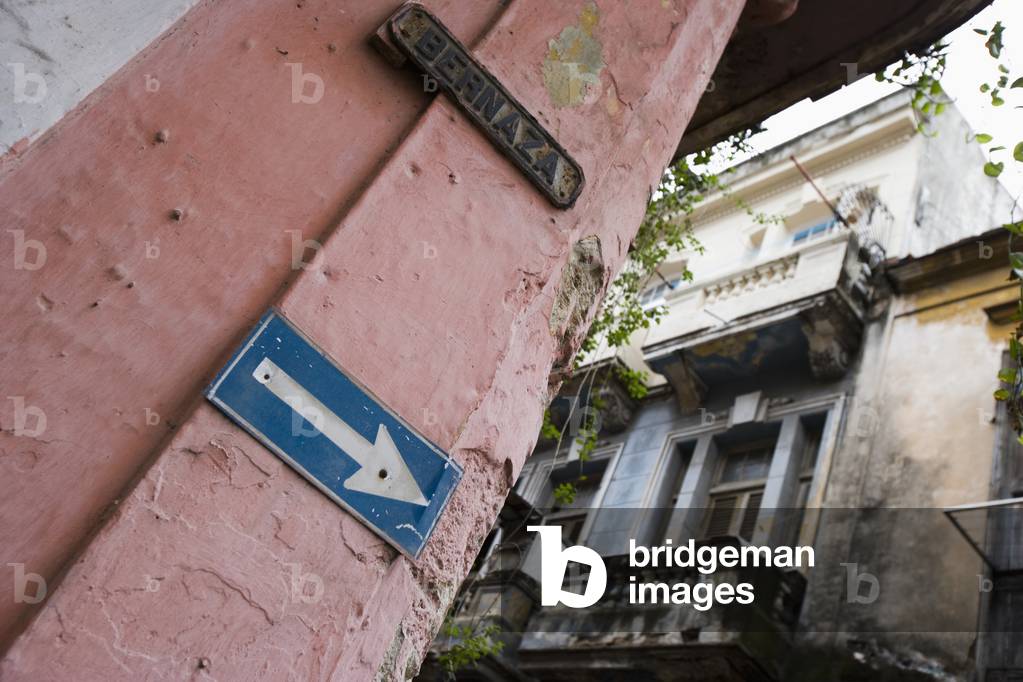 Arrow Sign on Old Buiding (photo)