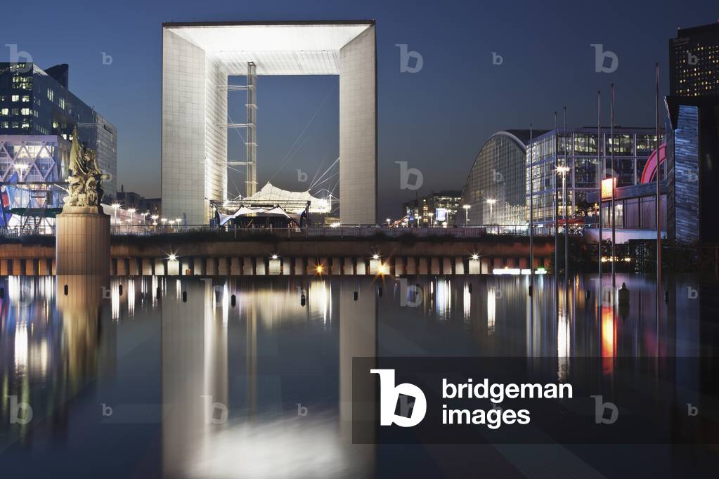 Modern buildings at the water's edge illuminated at dusk, Paris, France (photo)