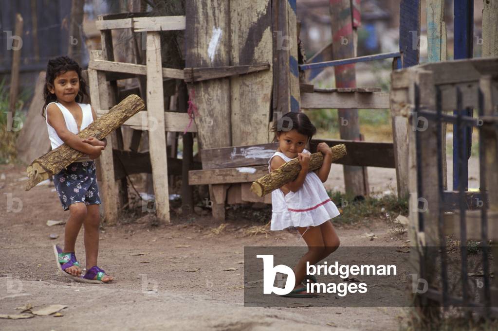 Two Children carrying Wood (photo)