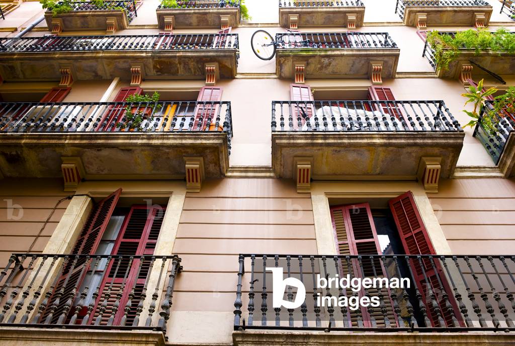 Low angle view of shutter doors on balconies, Barcelona, Spain (photo)