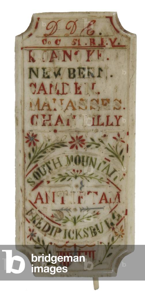 Bone badge with battle honors carved by a soldier