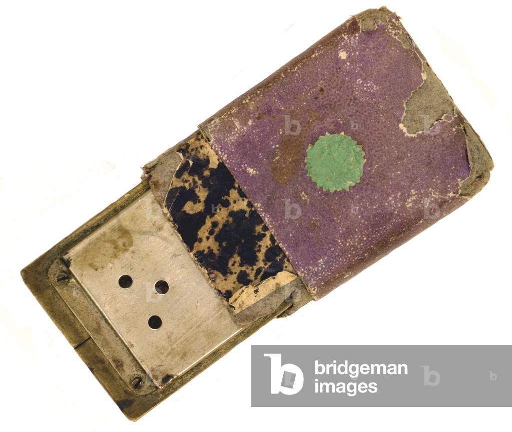 Soldier's harmonica and pasteboard box.