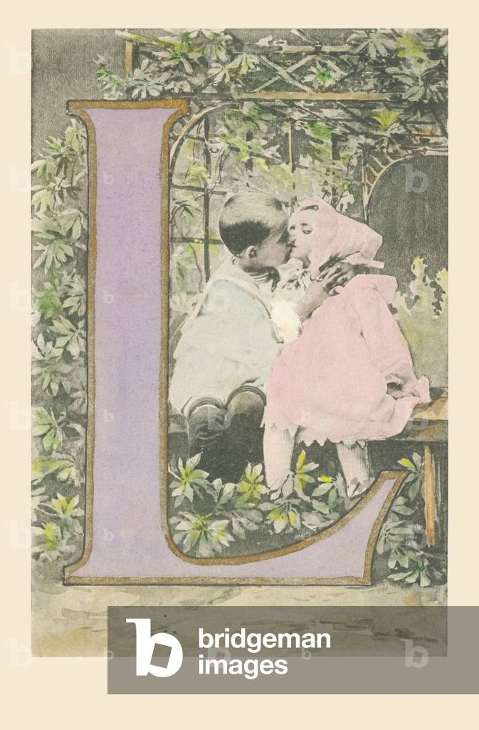 L: A boy and a girl sitting on a bench and kissing