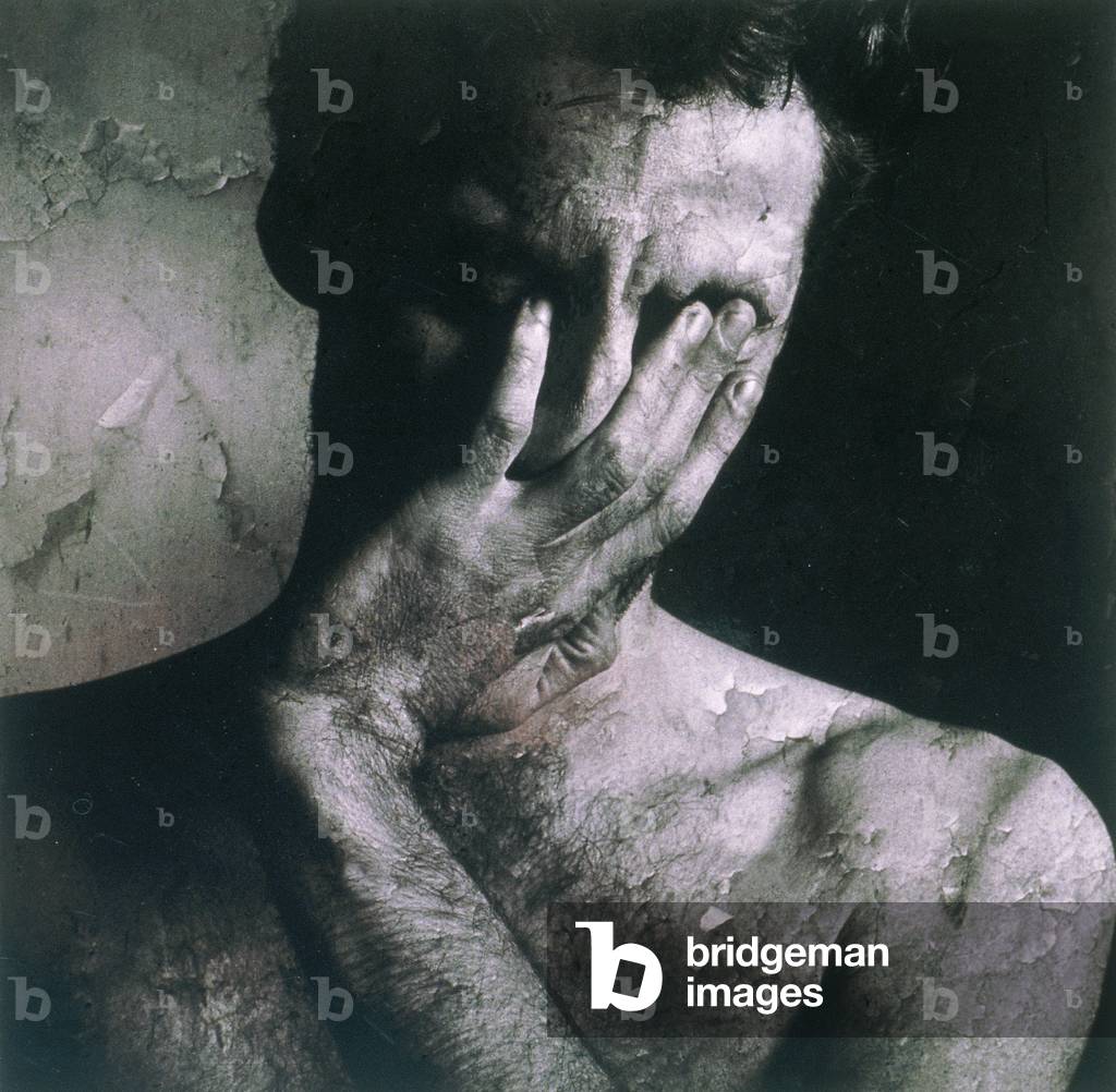 Man with Hand on Face