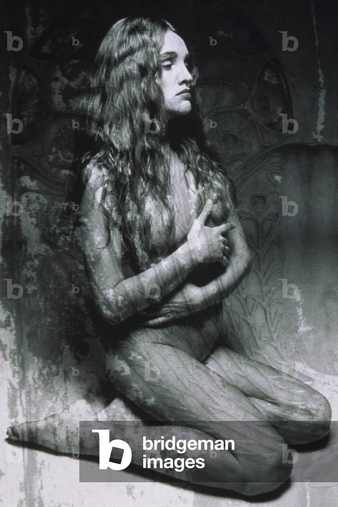 Nude woman posing in studio