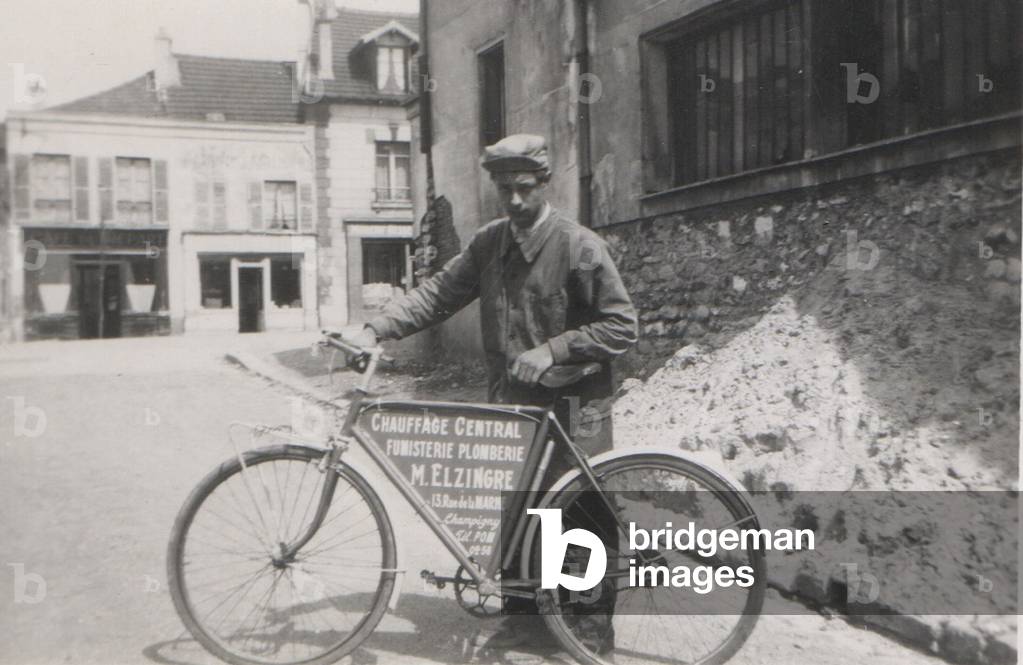 Plumber and his advertising bike around 1945