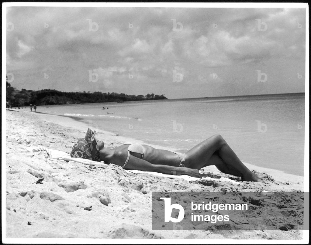 SUNBATHING ON SAND