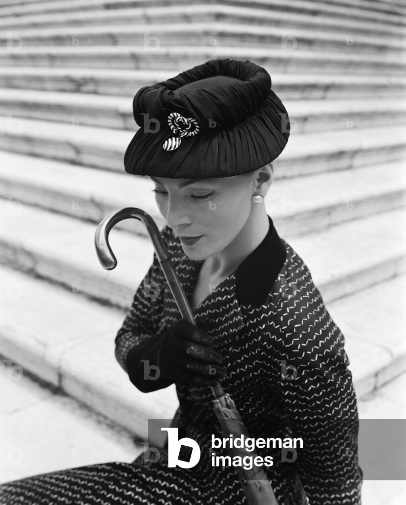 A model wearing Christian Dior fashions in Venice, 3rd June 1951 : With The Umbrella