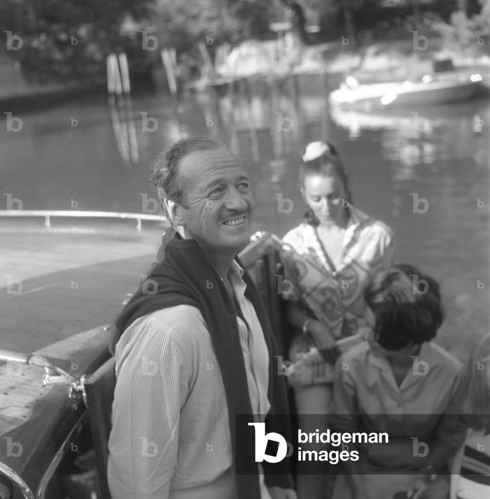 British actor David Niven portrayed on a water taxi at Lido, Venice, 1970s : On A Water Taxi