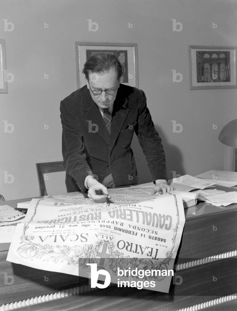 The artistic director Mario Labroca checks the 'La Scala' theater program, Milan, Italy, 1948 : Cavalleria Rusticana