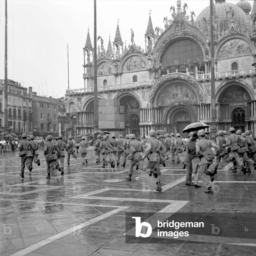 Police charging the student in St. Mark Square during the demontration against the Biennale, Venice, 1968 : Running
