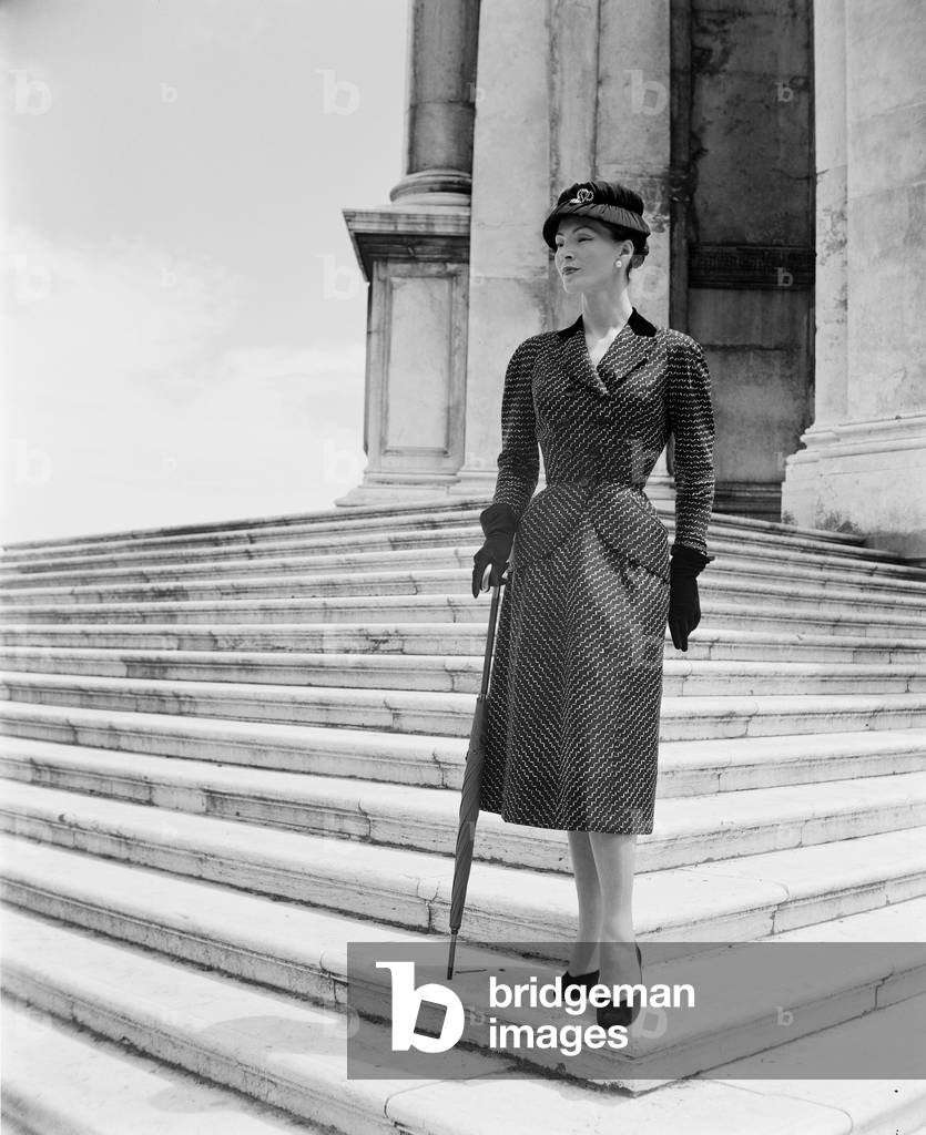 A model wearing Christian Dior fashions in Venice, 3rd June 1951 : Looking At The Laguna