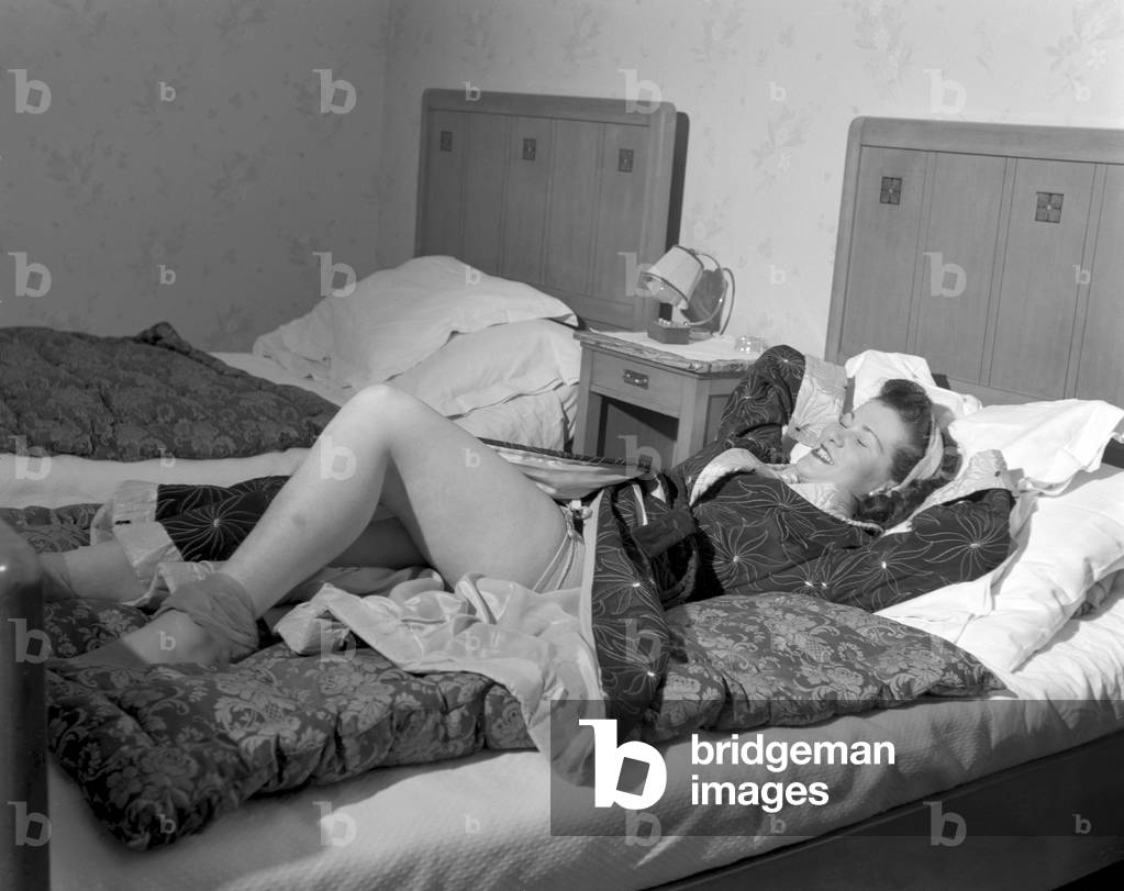 An American young woman lying up in bed, Lausanne, 4th January 1949 : Lying Up