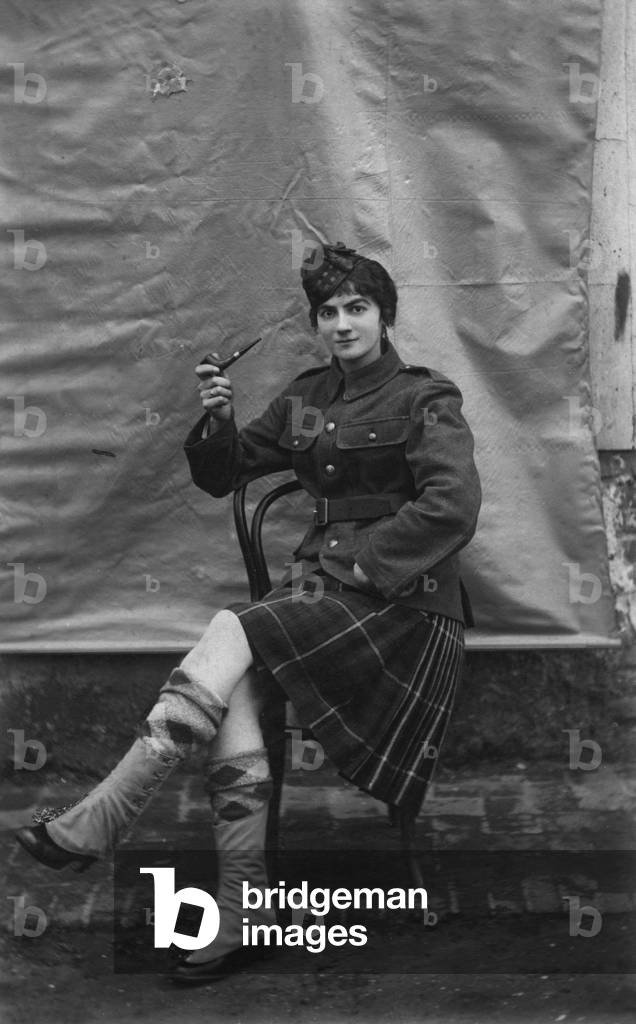 Woman wearing a Scottish uniform and pipe, ww1 (b/w photo)