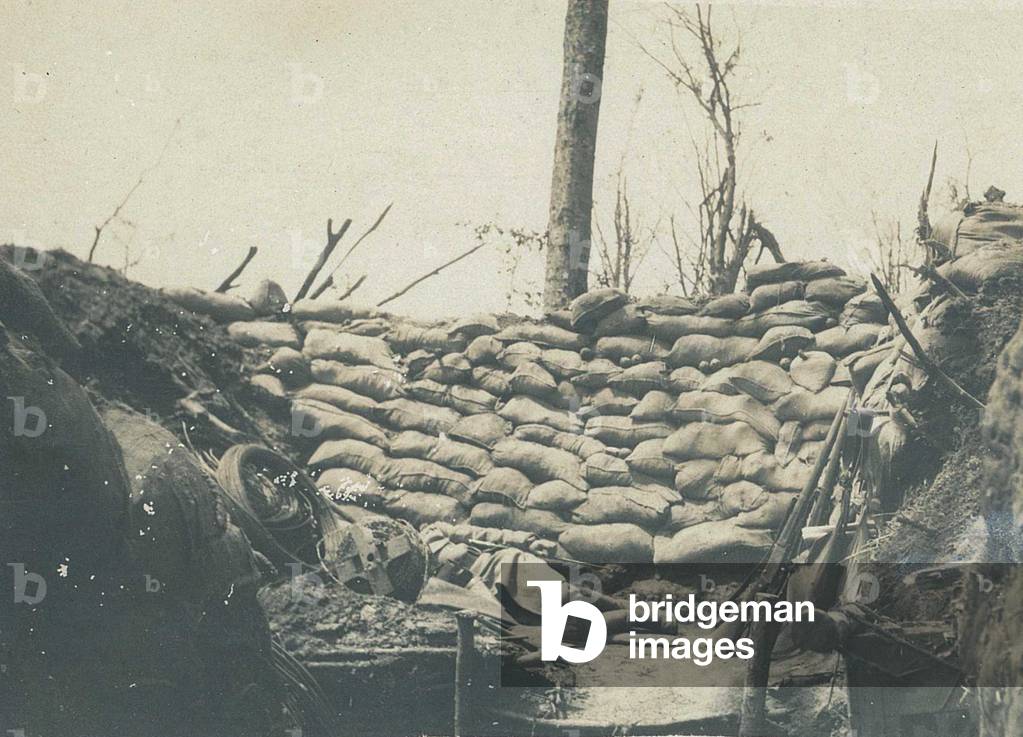 French soldier sleeping in a trench barricaded with sacks of earth - World War 1 (1914-1918)