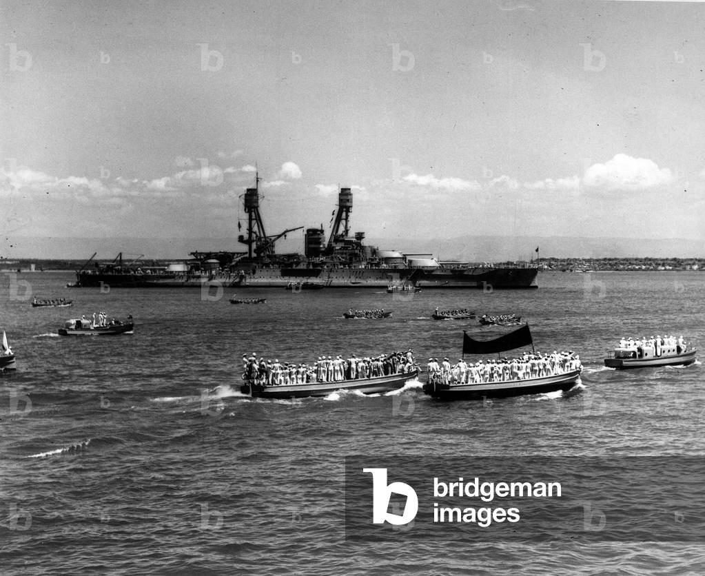 Guantanamo Bay (Cuba), circa 1930: The last straight line of the race of the American fleet oars crews (Poughkeepsie Regatta). In the background, USS Nevada (BB-36) - Guantanamo Bay, Cuba, ca 1930: Poughkeepsie Regatta, final “” whaleboat”” races of the US Navy's battleships, with USS Nevada (BB-36) in the background