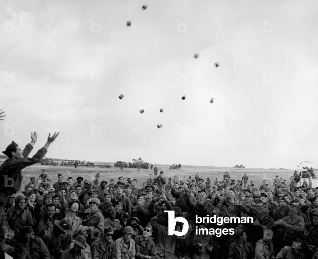 Near Reims (Marne) France 23 August 1945: At the US Army camp New Orleans where American soldiers awaiting redeployment are stationed in the Pacific theatre of operations, festivities were organized to evoke the “Mardi Gras” of the city of Louisiana, including a free distribution of peanut packages