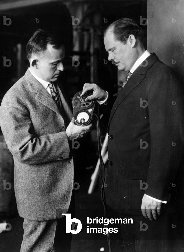New York City (USA), circa 1930: Professor Ernst Frederick Werner Alexanderson (1878-1975) (left) and his assistant S.P Nixdorff examining the light altimetre echo or colours indicate altitude of flight - New York City (USA), ca 1930: Inventor Ernst Frederick Werner Alexanderson (1878-1975) (left) and his assistant S.P Nixdorff with his new radio echo altimeter where colored lights indicate altitude