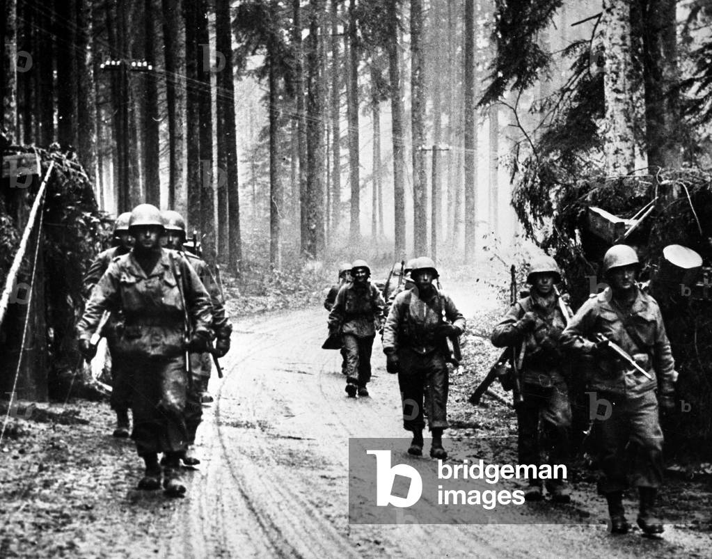 WWII:Near Raon-l'Etape (Vosges) 18 November 1944: Infantrymen from the 339th RI of the 100th US DI “Century Division”” advance into the forest after liberating the city